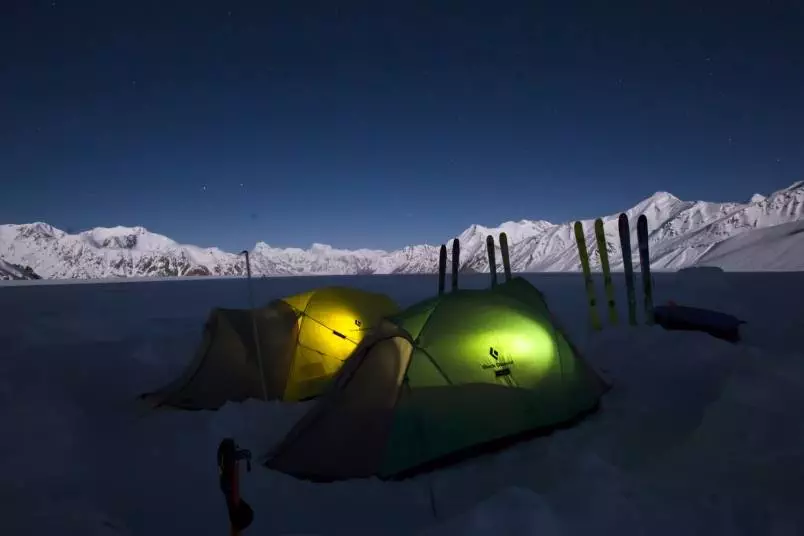 A group of tents in the snow, surrounded by the exhilarating adventure and breathtaking scenery of Whistler.