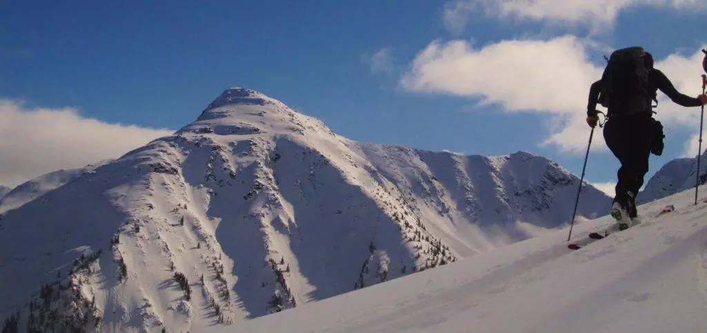 A person is skiing down a mountain in Canada.