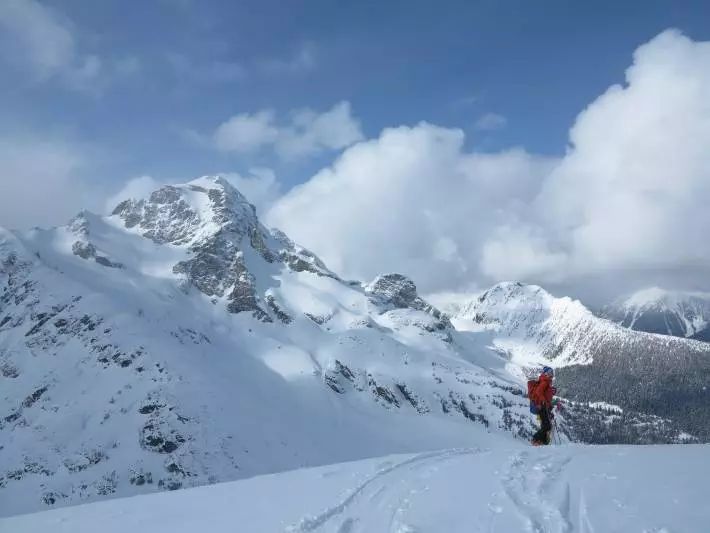 A skiing adventure on a snow covered mountain.
