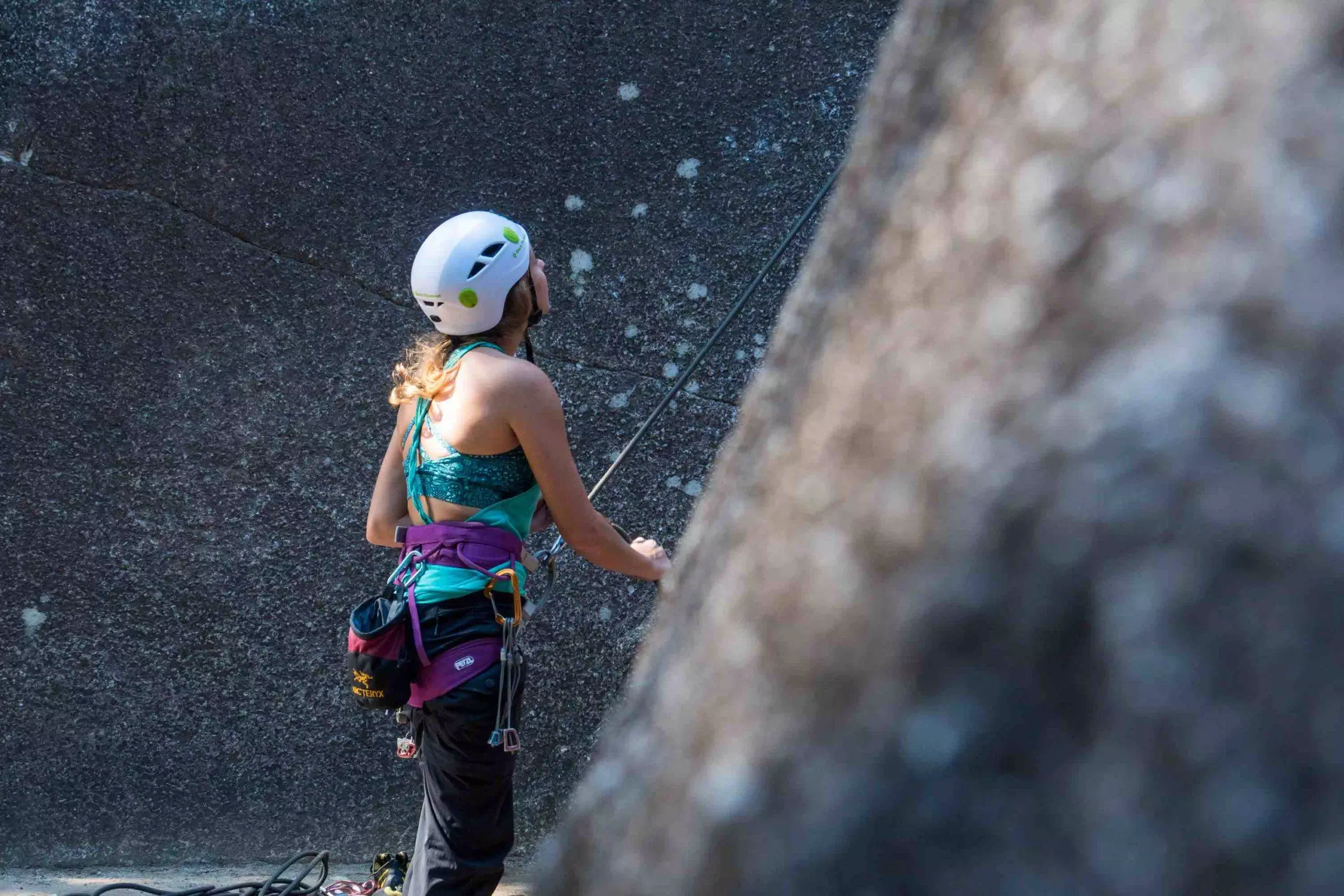 Teenage Girl belaying rock climbing Squamish BC