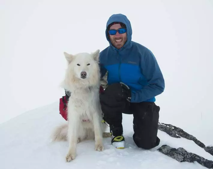 Ski touring dog with male skier